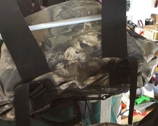 Lots of hunting clothes and equipment; various manufacturers and various sizes.