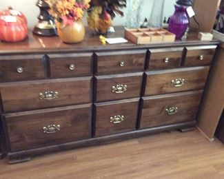 9 drawer maple dresser. Lots of lovely floral arrangements, vases Knick knacks