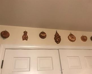 Large collection of copper molds, kitchen tools, copper wall art, fun and function