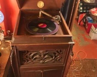 Antique phonograph with a ton of albums available