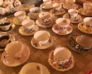 A ton of teacups...Upstairs, downstairs, everywhere there are tea cups.
