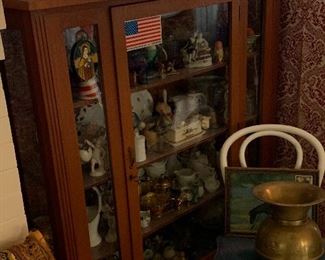 Another glass front display cabinet. Really lovely. And a cool old brass spittoon.