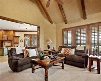 Double reclining sofas, end tables, flat screen TV’s