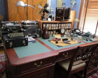 large desk & typewriters