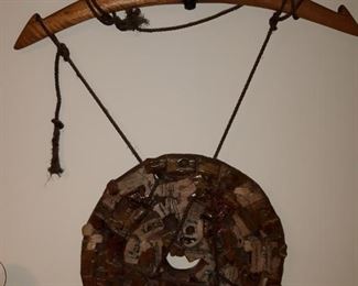 Pottery sculpture home from wooden beam