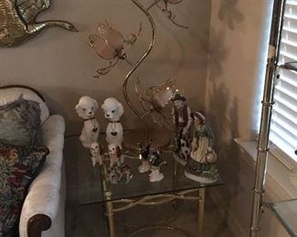 There is actually a pair of these glass top end tables and a couple of the interesting lamps.