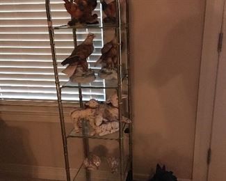 Brass and glass curio shelves.