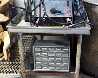 Miller Thunderbolt Arc Welder, Model 225, Needs Repair, Includes Welding Rod And Metal Table, 33" x 24" x 42"