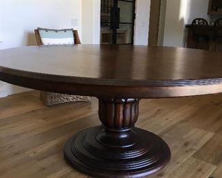 Like new 72” round, solid wood pedestal dining table. $1750.00