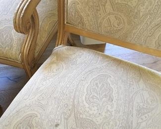 Kreiss dining chairs. Photo 3 of 3. Close up of wear on arm chairs, and 1 chair has a mark on the fabric.