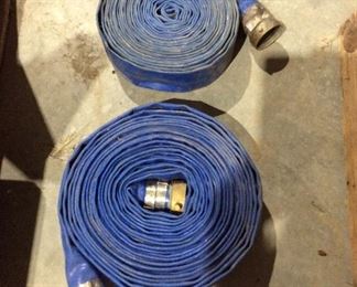 Two vinyl 2 inch water hoses brass fittings