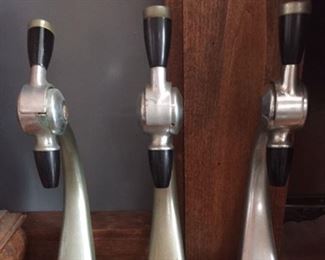 Vintage metal beer taps with attached drain