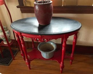 Red oval side table