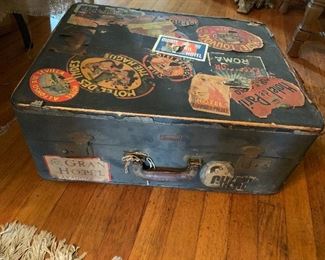Old suitcase with original luggage travel labels