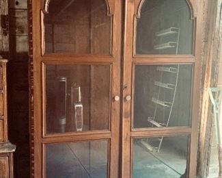 Walnut armoire with glass fronted doors