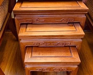 Four carved nesting tables