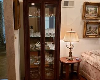 Beautiful lighted mahogany display cabinet with glass door and shelves probably Henredon