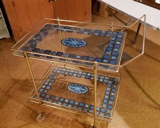Really neat turquoise painted brass tea liquor cart in good condition with just a little  bruising here and there. Looking for a new home :)