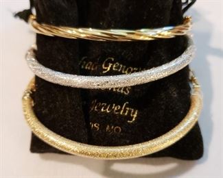 Three gold bangle bracelets