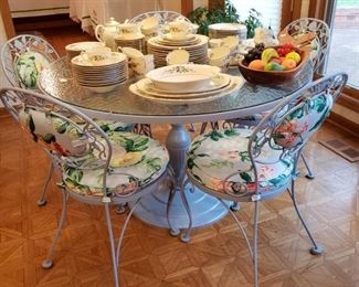 Wrought iron glass top pedestal table with five chairs