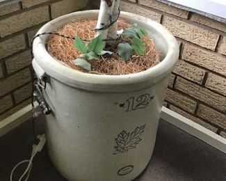 Old crock with faux birch tree