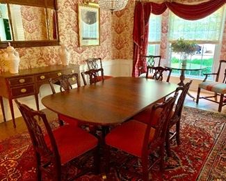 Kindel flame mahogany double pedestal dining table and 10 chairs.