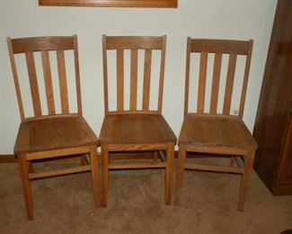 Four vintage wooden straight back chairs  (3 shown)
