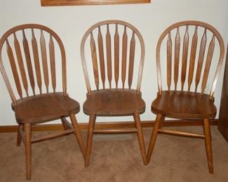 Four Royal Pacific round back wood chairs (3 shown)
