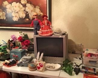 TV, tv stand, and Various items from bathrooms and bedrooms