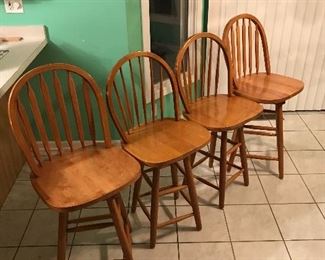  Set of four matching swivel top stools