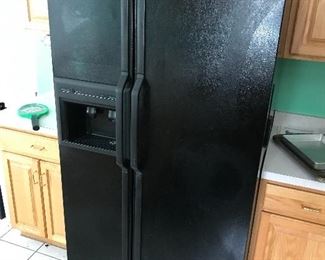 Side-by-side  Amana refrigerator freezer