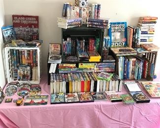 Large assortment of DVDs, Nintendo Xbox games, CDs and children’s books