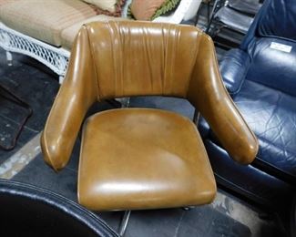 Vintage MCM light brown vinyl padded swivel armchair