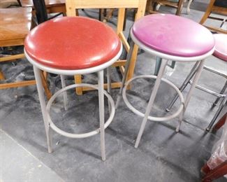 (2) Gray painted metal frame vinyl padded top bar stools (1) red (1) purple