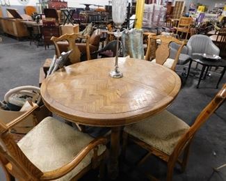 Solid Oak round dining room table with leaf & 4 chippendale style chairs (2) Arm (2) side