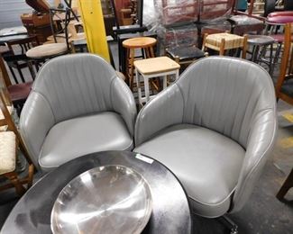 (2) MCM gray vinyl bucket style swivel chairs on wheels