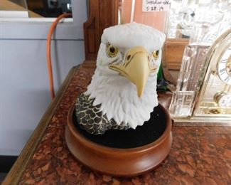 Eagle bust with wooden stand