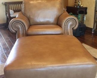 Bassett leather chair and ottoman - ottoman opens up for storage - excellent condition
