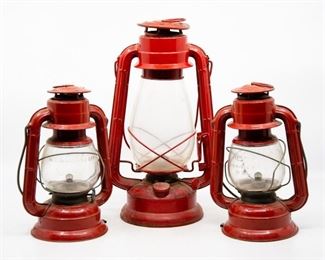 Lot 4. Set of 3 red railroad lanterns. Metal and glass. Two are Dietz brand Comet models (Made in USA), the other is Winged Wheel (Made in Japan).