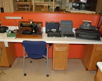 vintage typewriters and an old Singer sewing machine