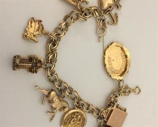 Vintage Gold Charm Bracelet and Charms https://ctbids.com/#!/description/share/225572