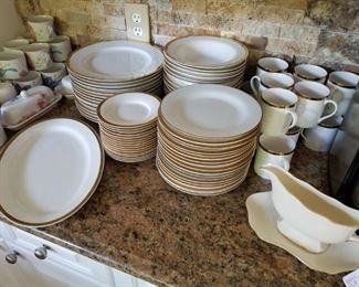 Pier 1 and Pottery Barn dishes.  Cream with gold trim