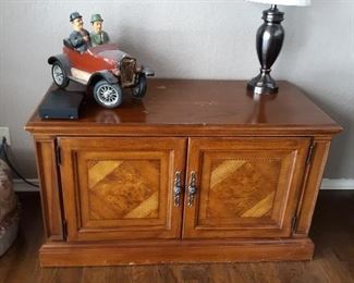 Burl wood cabinet holds all kinds of electronic stuff