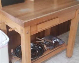 butcher block island , desk pieces placed on top