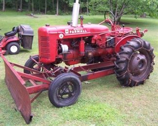 THIS IS A 1948/49 FARMALL TRACTOR WITH PLOW