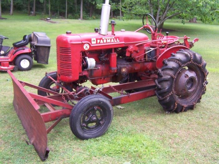 THIS IS A 1948/49 FARMALL TRACTOR WITH PLOW