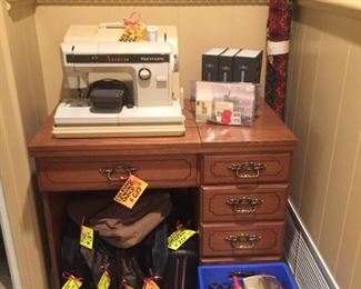 Vintage Kenmore Heavy-Duty Sewing Machine + all attachments -- works great! Very nice sewing cabinet.