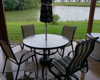 Outdoor table, chairs and umbrella