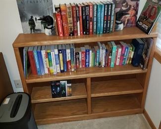 Wood bookcase, paper shredder, books