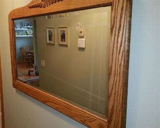 Beveled glass mirror in wood frame